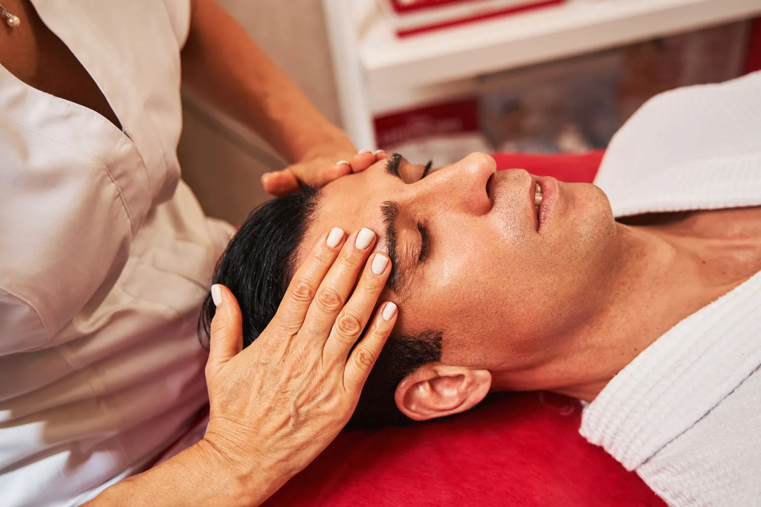 woman is massaging man forehead with hands 2023 11 27 05 03 36 utc